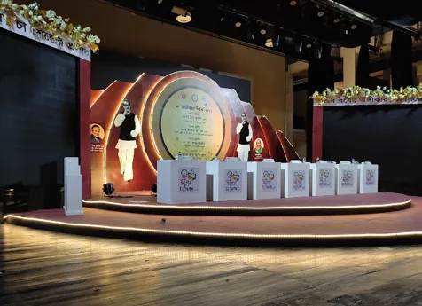 Trophy and award display arranged on a lit presentation stage