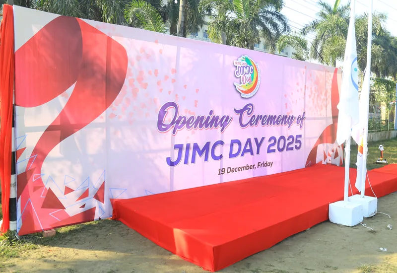 Large printed opening ceremony backdrop for JIMC Day 2025
