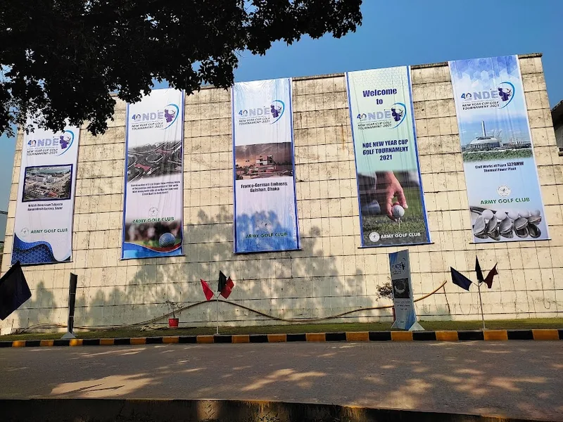Row of large-format outdoor banners mounted along a boundary wall